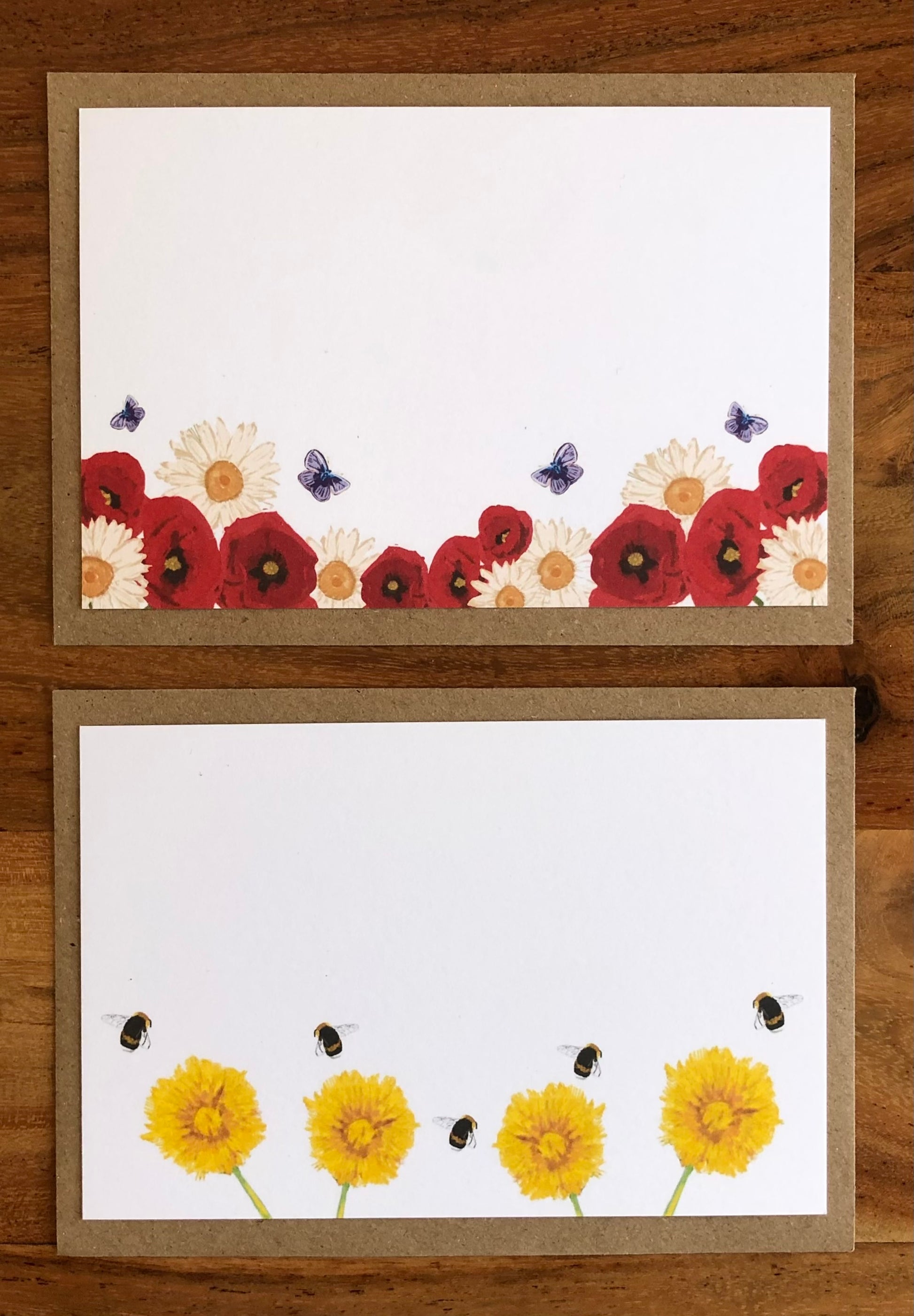 Close-up of hand-illustrated poppy, daisy and dandelion design on recycled luxury notecard