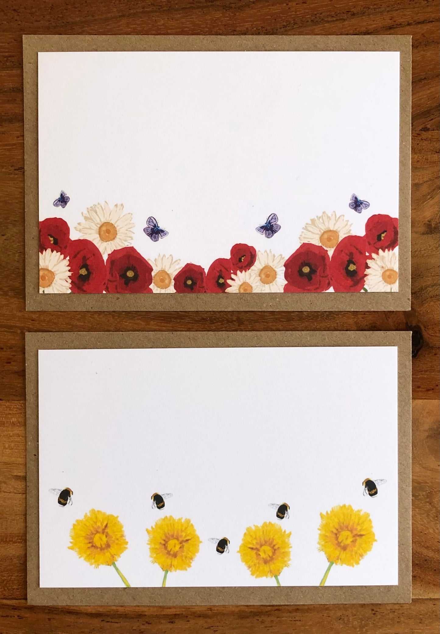 Close-up of hand-illustrated poppy, daisy and dandelion design on recycled luxury notecard