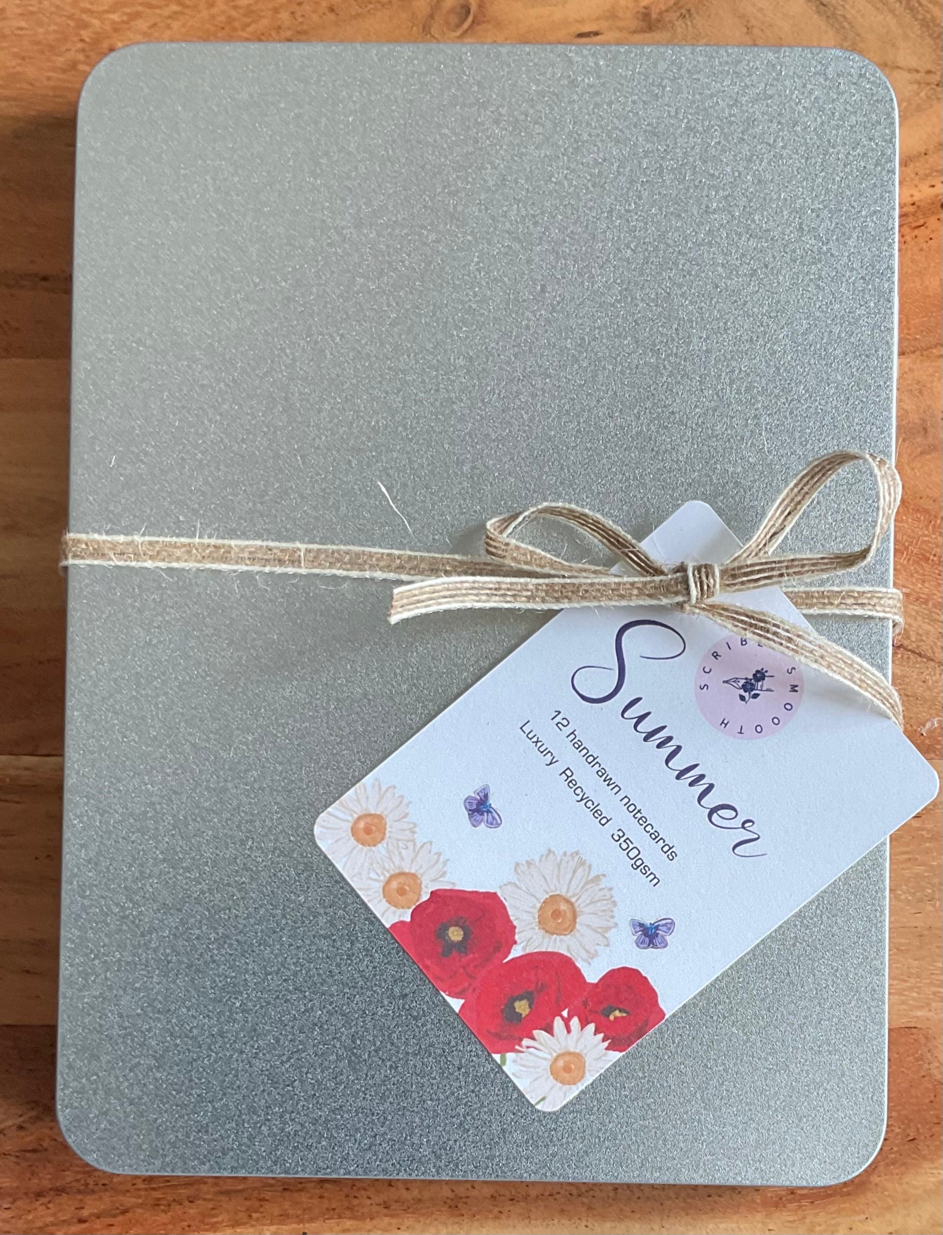 Sustainable metal gift tin containing 12 British wildflower notecards with recycled envelopes