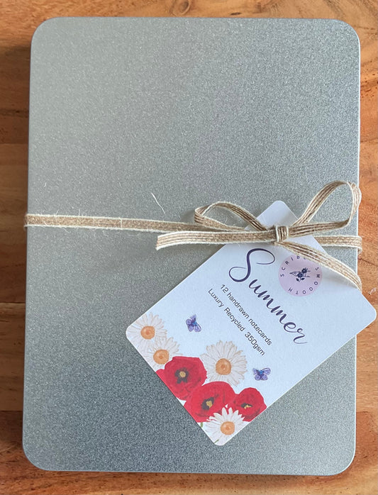 Sustainable metal gift tin containing 12 British wildflower notecards with recycled envelopes